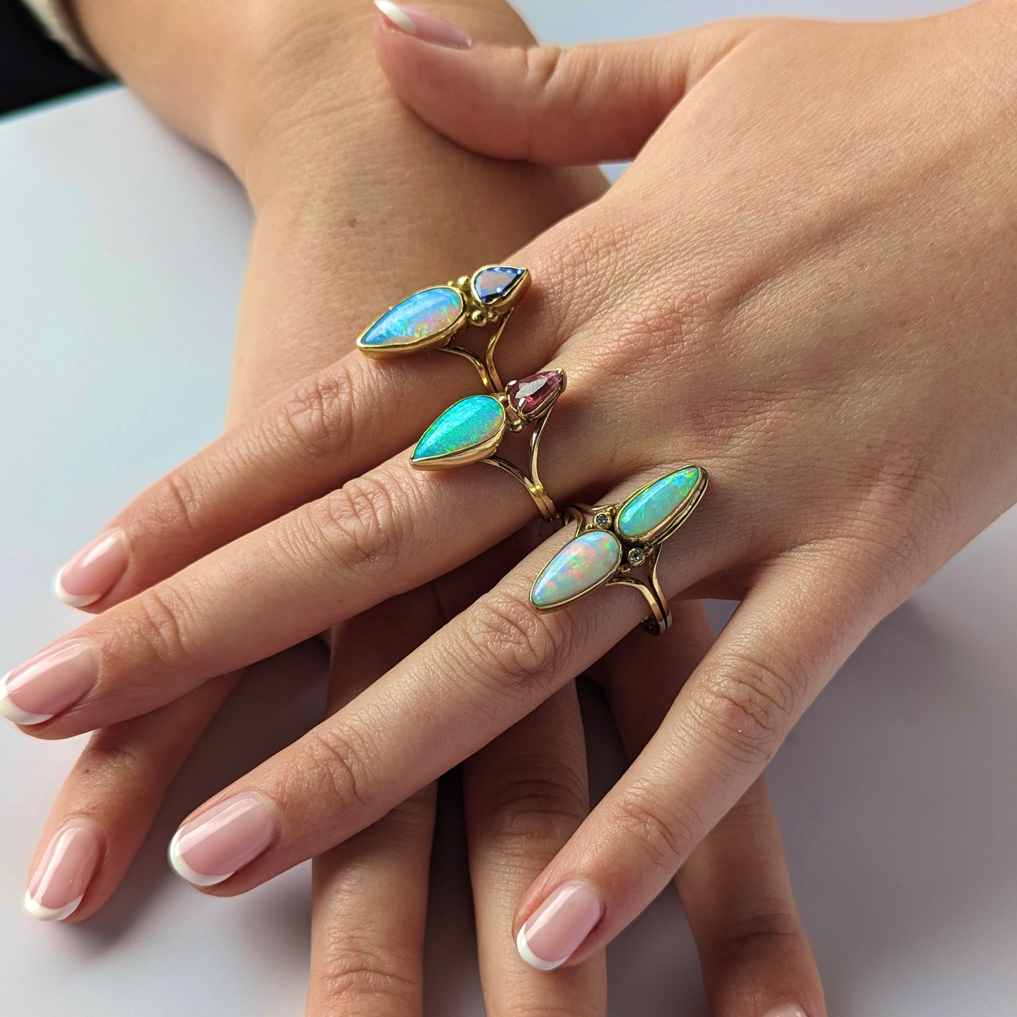 opal split shank rings on hand