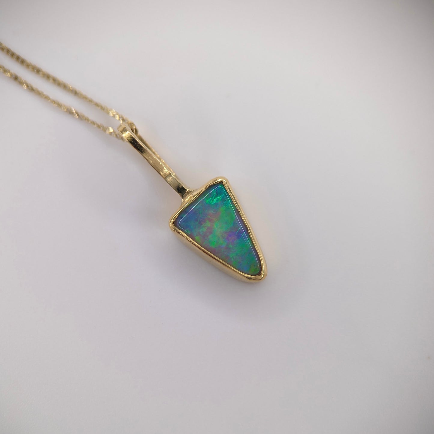 Petite Bright Crystal Opal Pendant in 18k Gold. Assay Hallmarked