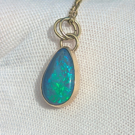Black Opal Pendant with Blue Green fire in 9K yellow gold