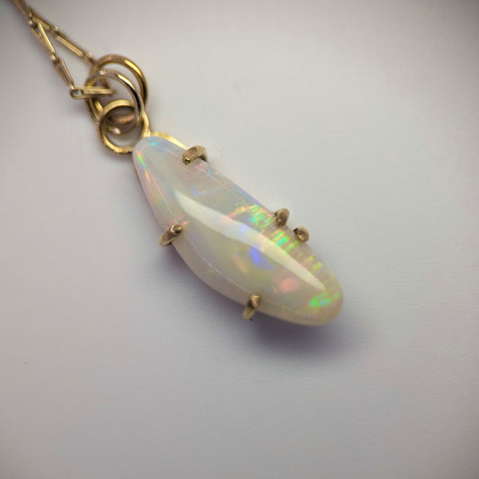 Prong Set Pendant with an Australian Opal Carving in 18K Yellow Gold