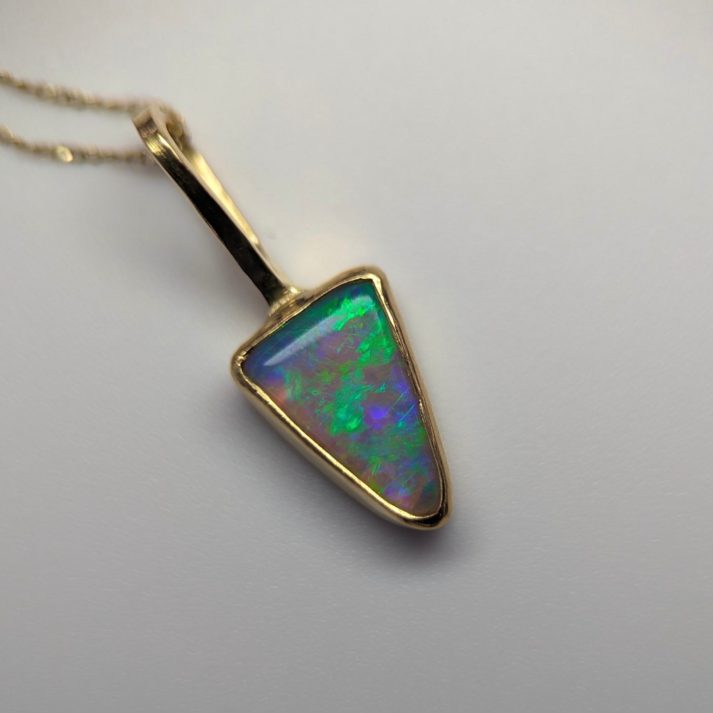 Petite Bright Crystal Opal Pendant in 18k Gold. Assay Hallmarked