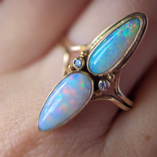 A Cocktail Split Shank Ring with Double Australian Opal and Accent Diamonds in 9K YellowGold, Assay Hallmarked.