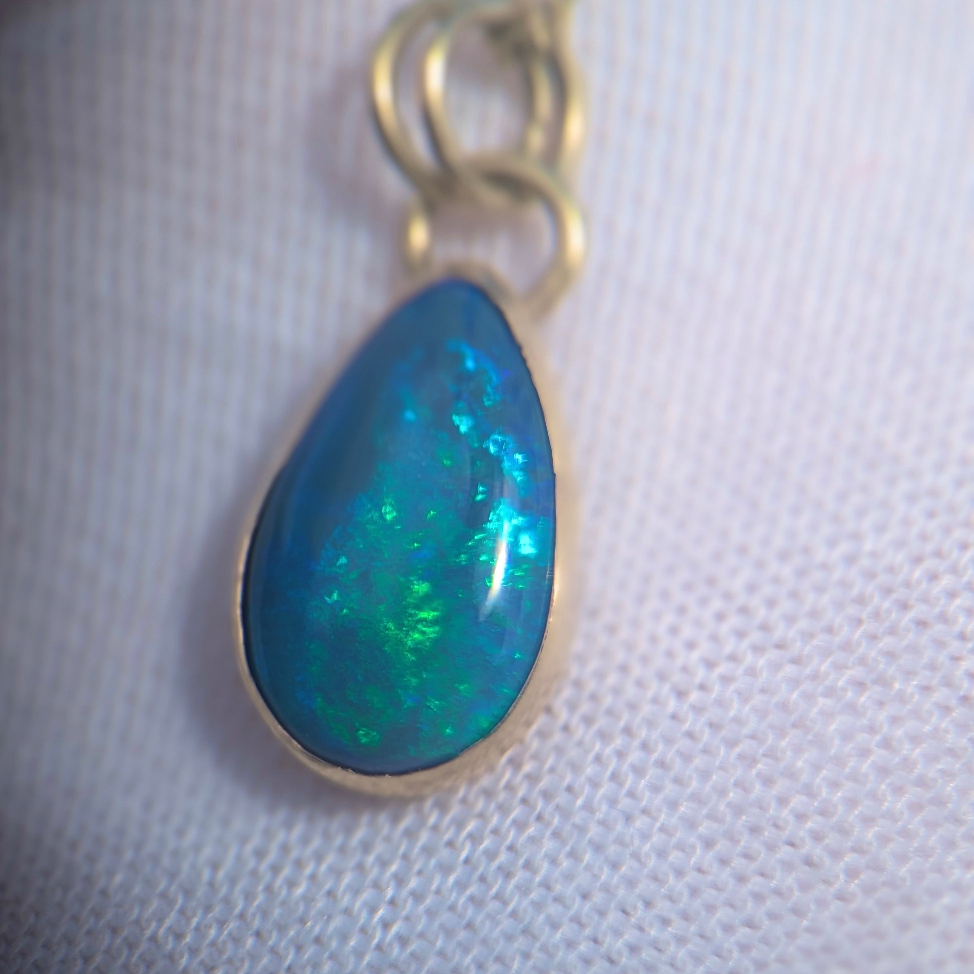 Black Opal Pendant with Blue Green fire in 9K yellow gold