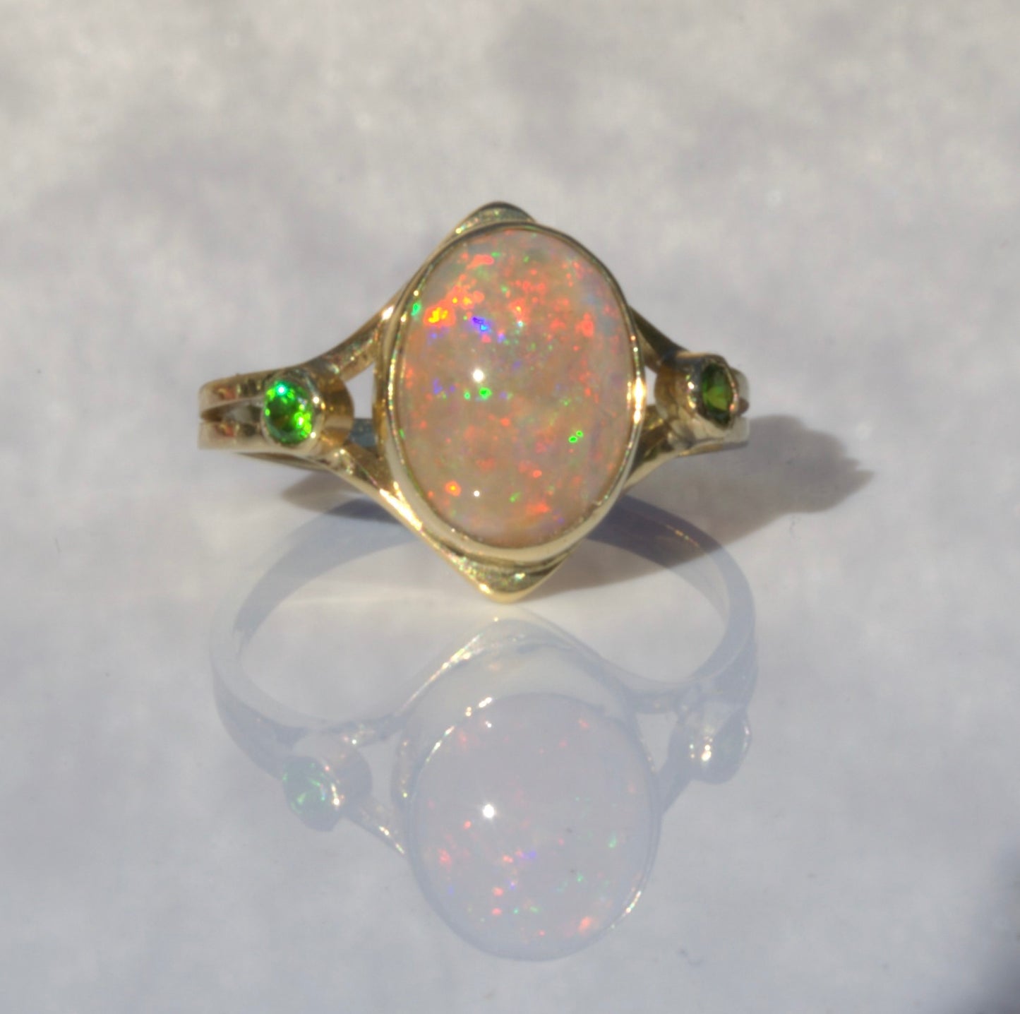 A Rare Eggshell Australian Opal Ring with Accent Demantoid Garnets in 18K Yellow Gold