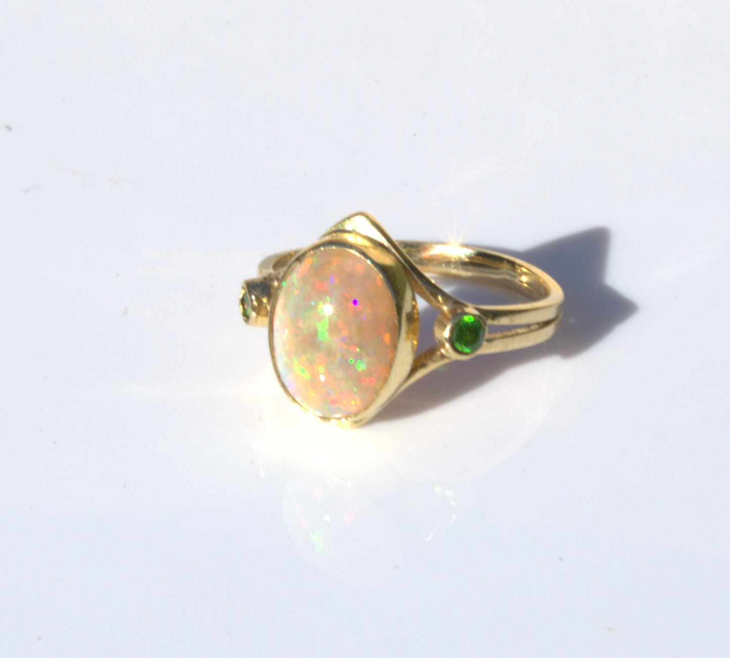 A Rare Eggshell Australian Opal Ring with Accent Demantoid Garnets in 18K Yellow Gold