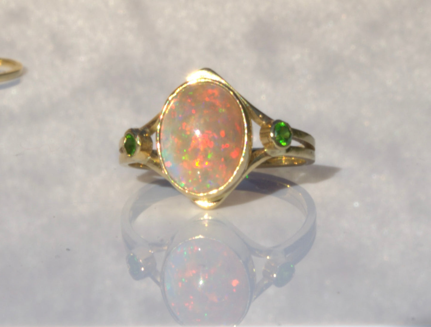 A Rare Eggshell Australian Opal Ring with Accent Demantoid Garnets in 18K Yellow Gold