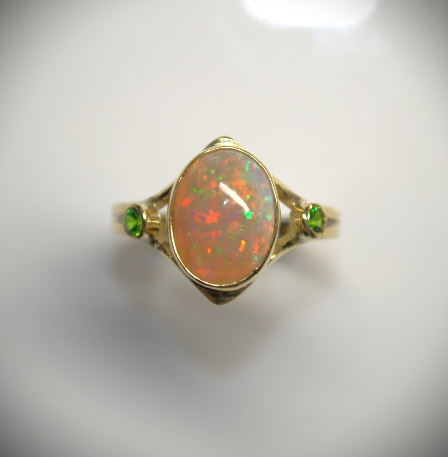 A Rare Eggshell Australian Opal Ring with Accent Demantoid Garnets in 18K Yellow Gold