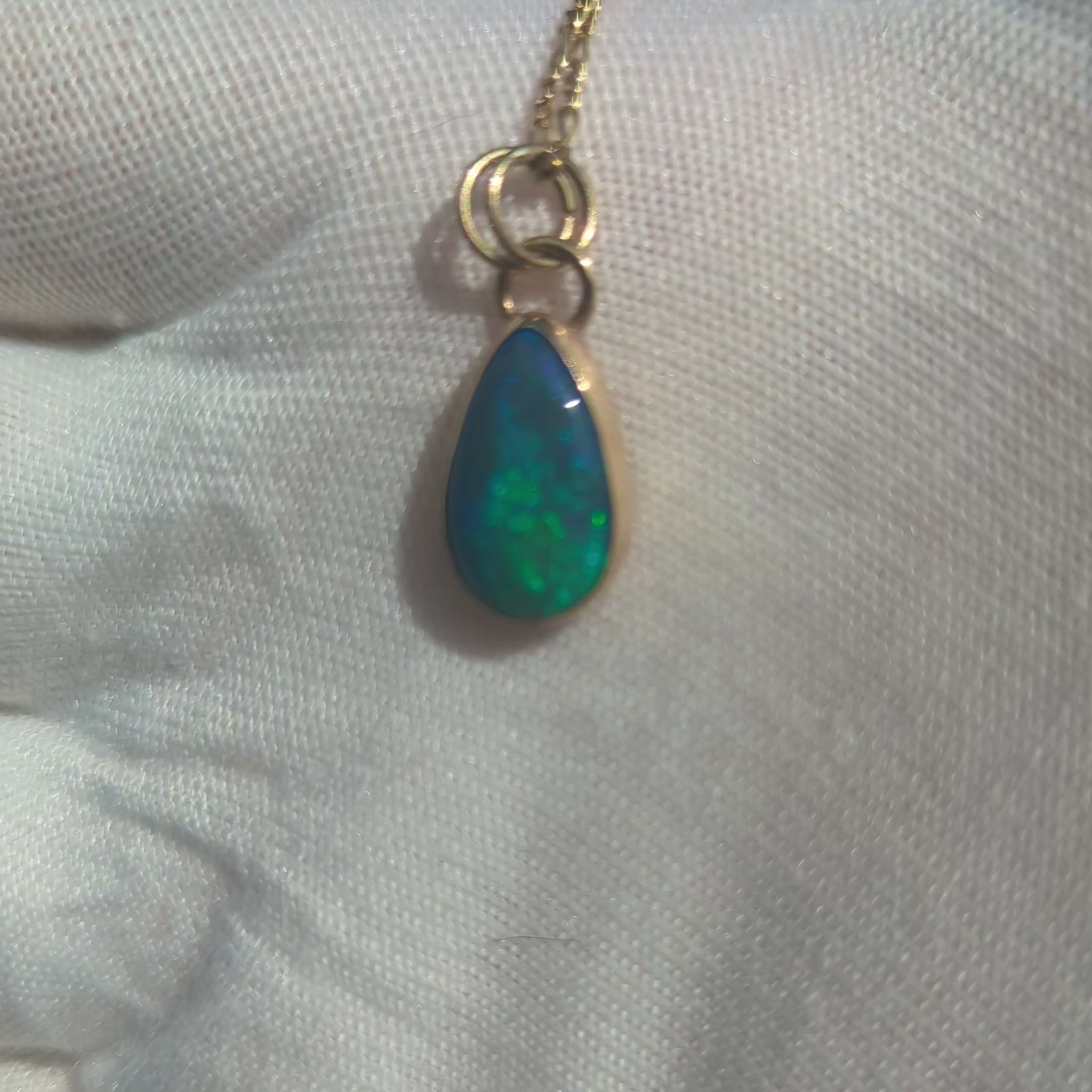 Black Opal Pendant with Blue Green fire in 9K yellow gold